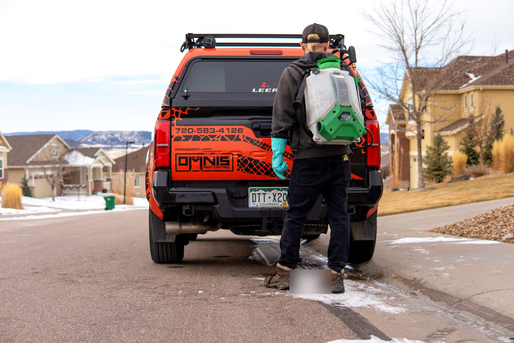 OMNIS technician heading out to treat a home