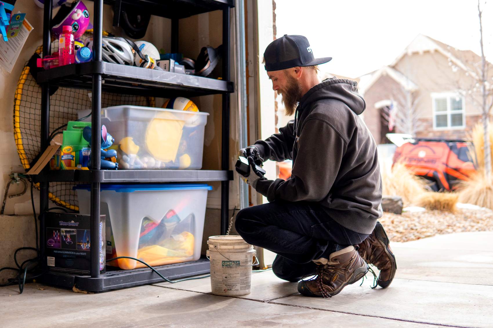 OMNIS technician setting a bait station